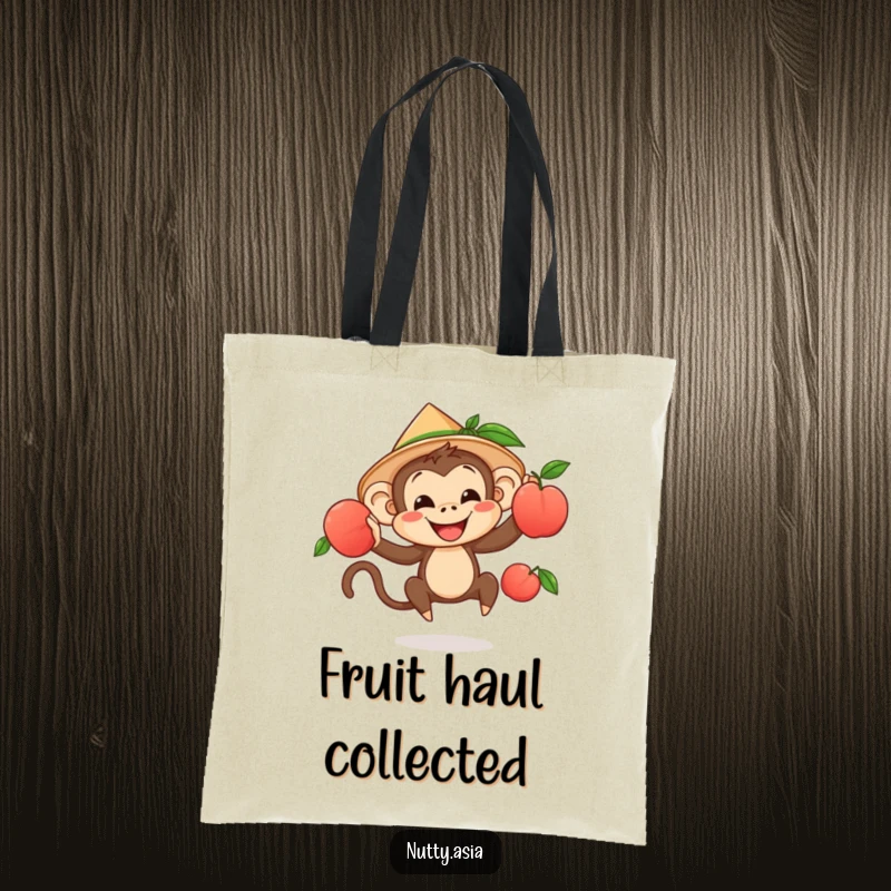 Playful monkey juggling peaches in a conical hat, a stylish and humorous tote bag.